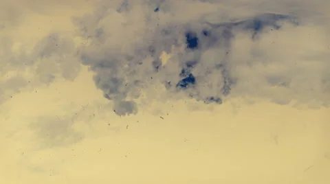 Timelapse. flying above clouds in a yellowish and rosy sky. Vintage film effect. Stock Footage 68344343