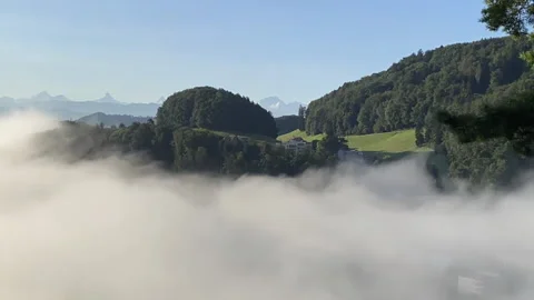 Timelapse of fog moving through the Valley of Koeniz, Switzerland Stock Footage