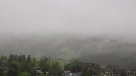 Timelapse of fog rolling over the Tatra mountain range with light rain and .. Vídeos de archivo 329063574