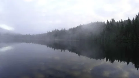 Timelapse on the foggy lake in the morning Stock Footage