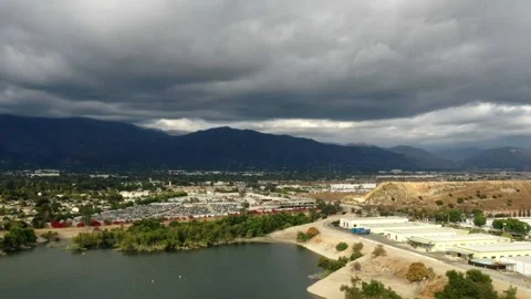 Timelapse Footage of Clouds Moving Across a Blue Sky Over a Lake Stock Footage 150722192