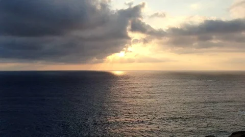 Timelapse footage Clouds Moving sunset over the sea Stock Footage 115021445