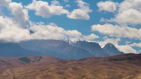 Timelapse Footage of Clouds Passing Over a Kyrgyz Mountain Valley – Changing Ski Stock Footage 306577097