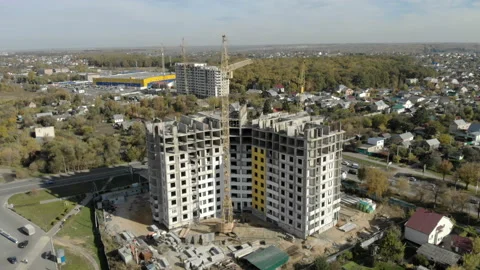 Timelapse footage of a large construction site with several busy cranes, blue Stock Footage 97122877