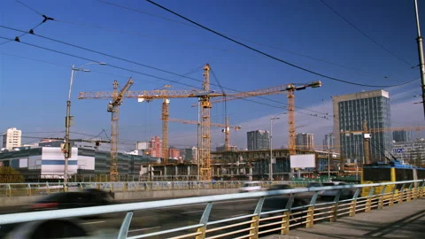 Timelapse footage of а large construction site, with several busy cranes, many w Stock Footage 137093615