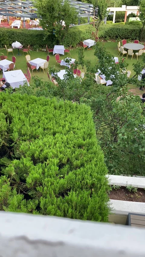 A timelapse footage of an open air restaurant preparing for dinner. Stock Footage 337943231