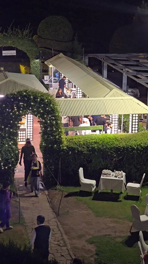 A timelapse footage of people dining in an open air restaurant. Stock Footage 340060058