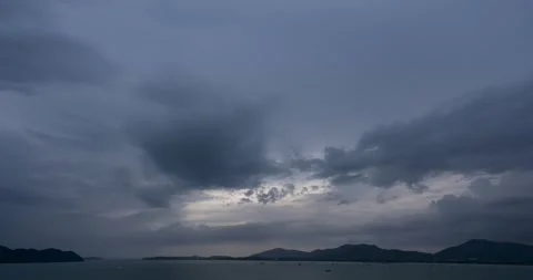 Timelapse footage of Storm clouds and rain over sea in bad weather day, Dark sto Stock Footage 221733631