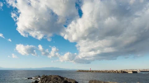 Timelapse footage of white clouds in the blue sky, Jogashima island, Kanagawa Stock Footage 151433261