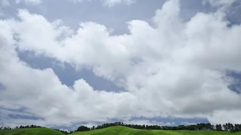 Timelapse footage of white clouds over green mountain plateau, Izu Peninsula Stock Footage 340241802
