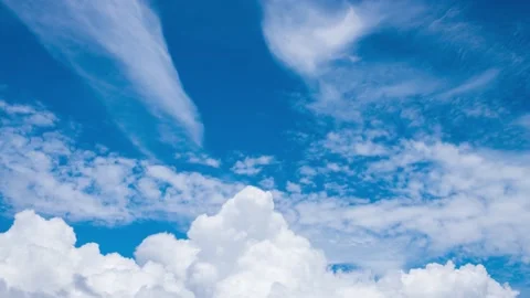 Timelapse footage of white fluffy clouds in the blue sky Stock Footage 219626064
