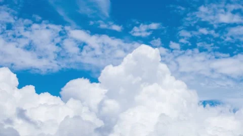 Timelapse footage of white fluffy clouds in the blue sky Stock Footage 219626066