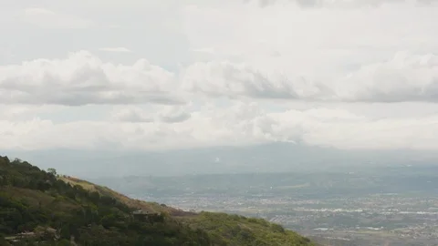 Timelapse of forest hill peaking above San Jose city on cloudy day Stock-Footage 141245645