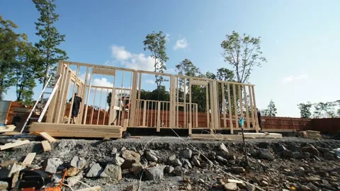 Timelapse of a frame house building site. The builders lift walls on the place Stock Footage 148064306