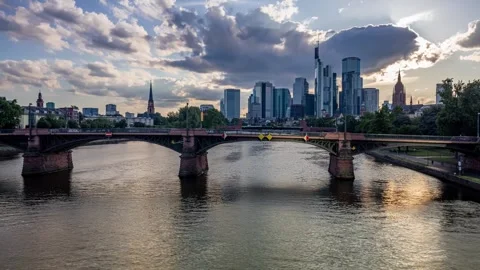 Timelapse of the Frankfurt am Main Skyline with sun and clouds. Main river with Video stock 312030341