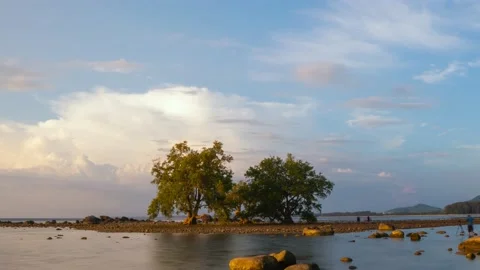 Timelapse full frame sunset sea Island beautiful rock blue sky background Stock Footage 151023473