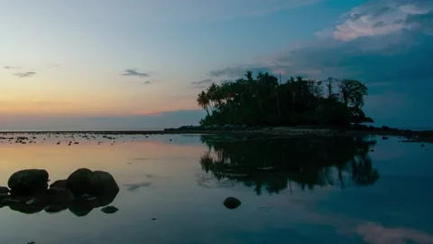 Timelapse full frame sunset sea rock Island cloud beautiful blue sky background Stock Footage 151023586