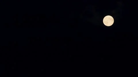 Timelapse of a full moon in a cloudy night sky Stock Footage 59374498