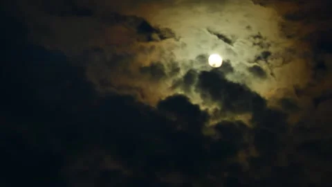 Timelapse of full moon, dark dramatic clouds in night sky, anamorphic time lapse Stock Footage 196204488