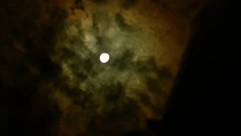 Timelapse of full moon, dark dramatic clouds in night sky, anamorphic time lapse Stock Footage 197396513