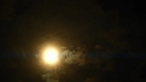 Timelapse of full moon, dark dramatic clouds in night sky, anamorphic time lapse Stock Footage 199370851