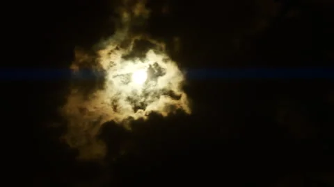 Timelapse of full moon, dark dramatic clouds in night sky, anamorphic time lapse Stock Footage 236081693