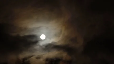 Timelapse of full moon at night with clouds moving in view Stock Footage 83705202