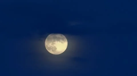 Timelapse full moon rising in evening against dark blue sky Stock Footage