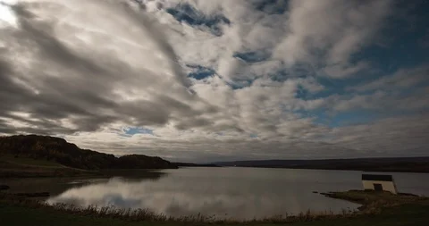 Timelapse of full moon rising over lake Stock Footage 105618970