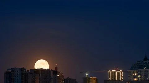 Timelapse full moon rising ower cityscape 1080p 60fps Stock Footage 108726095