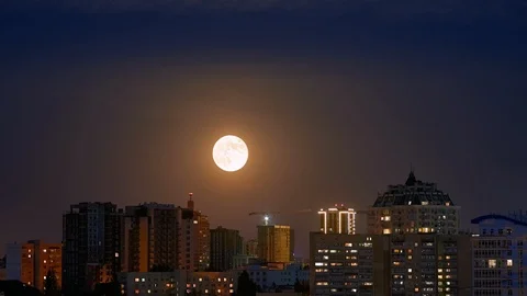Timelapse full moon rising ower cityscape 4K 60fps Stock Footage 108726222