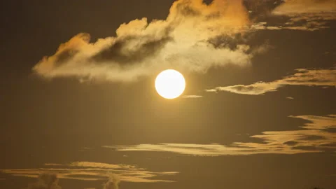 Timelapse - Full moon rising through the clouds Stock Footage 234831579