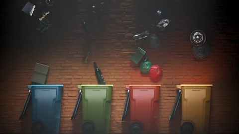 Timelapse with garbage falling to colorful trash bins next to the brick wall. Stock Footage 110072570