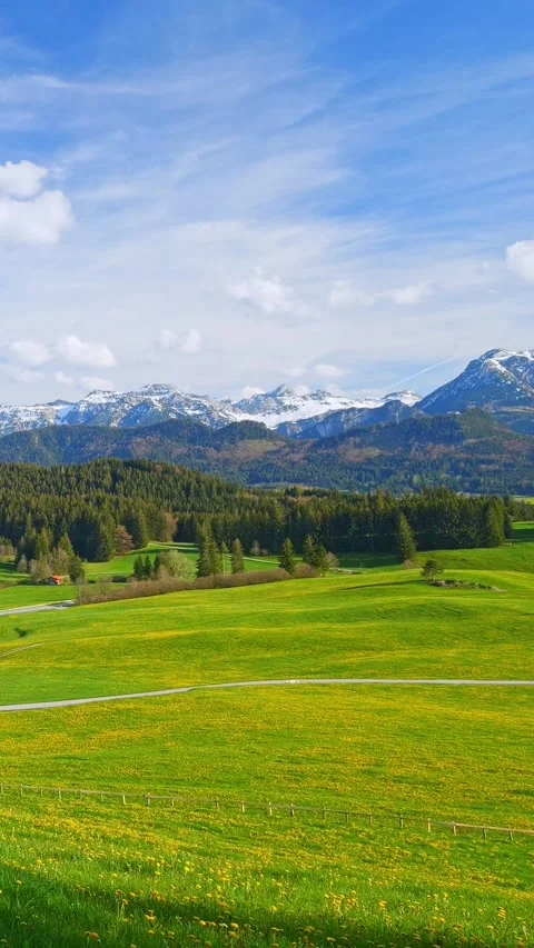 Timelapse of gentle cloud movement over rolling foothills and distant mountai Stock Footage 309227202