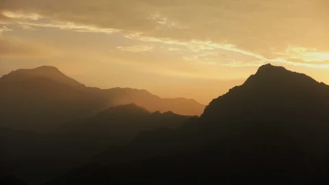 Timelapse of golden clouds over the mountains near Beijing China Stock Footage 124997652