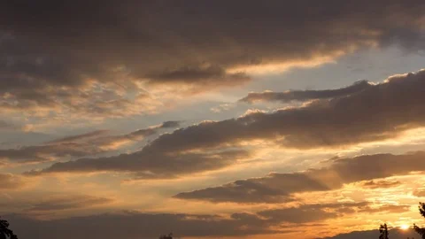 Timelapse  golden clouds at sunset Stock Footage 84440950