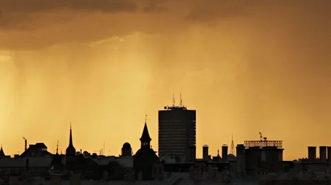 Timelapse of golden evening cloudy sky over city skyline with rain falling down Stock Footage 50022171