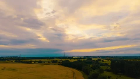 Timelapse golden grain fields beneath glowing sunset sky. Ripening wheat barley 動画素材 338068852