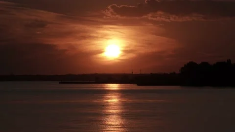 Timelapse of a golden sunset over the river Stock Footage 179364116