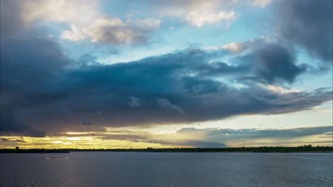 Timelapse of golden sunset with rainy clouds. Stock Footage 133901944
