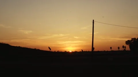Timelapse Golden Sunset Sky over freeway 動画素材 105319032