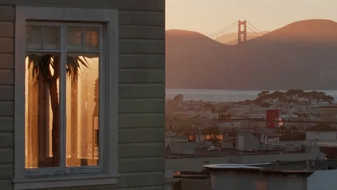 Timelapse of Golden Sunset with Window overlooking Golden Gate Bridge Stock Footage 125777282