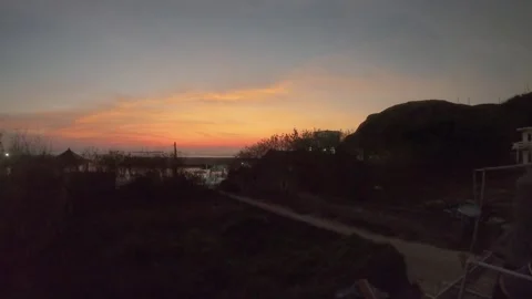 Timelapse of good weather sunset view sky color changes from bright orange to da Stock Footage 242326225