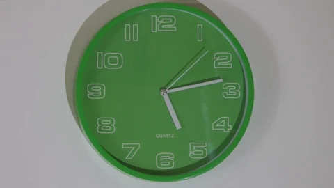 Timelapse green clock hanging on the wall Stock Footage 116899733