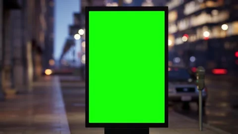 Timelapse of a green screen billboard on a city crossroad in the evening Stock Footage 345500178