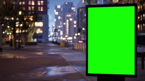 Timelapse of a green screen billboard on a downtown sidewalk late at night Stock Footage 345500195