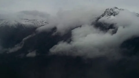 Timelapse of grey high blowing snow mountains with storm clouds and strong wind Vídeo Stock 69233587