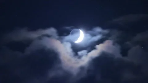 Timelapse half-moon rises swiftly above clouds in a starry night sky Stock Footage 321103700