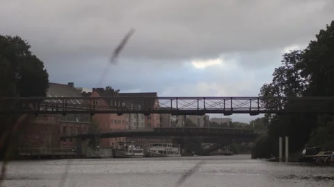Timelapse of Hanging River Bridge with Floating Boats Stock Footage 137278929