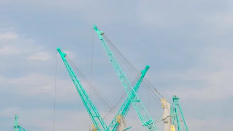 Timelapse: harbor cranes during work against cloudy sky in the sea port Stock Footage 335053120
